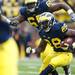 Michigan running back Fitzgerald Toussaint runs downfield in the first half against Michigan State on Saturday. Michigan leads at halftime 6-0. Daniel Brenner I AnnArbor.com